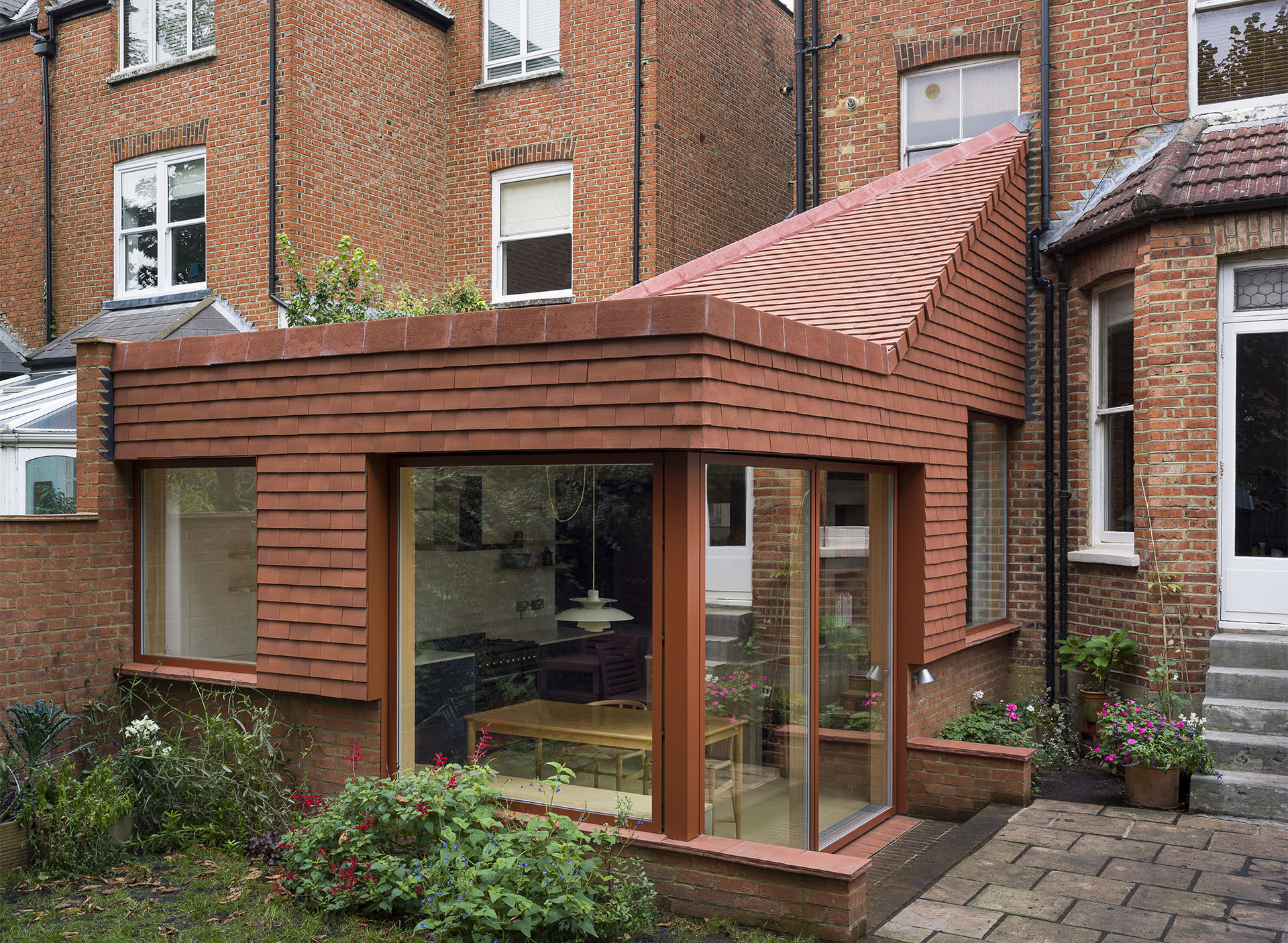 Red sandfaced tiles on Manber Jeffries House by James Alder Architects